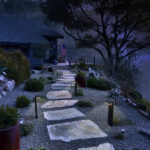 Solar pathway lights on stone path